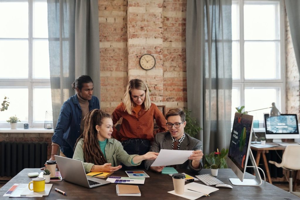 A Group of People Discussing Marketing Plans